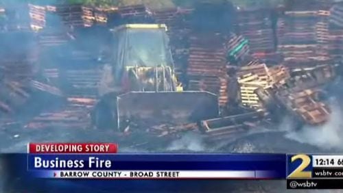 A fire at a pallets business in Barrow County closed a key roadway for part of Wednesday morning. (Credit: Channel 2 Action News)