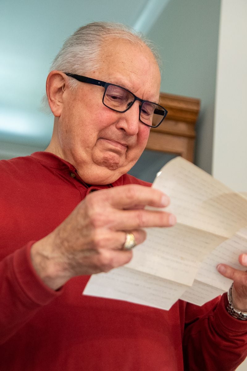 Bill Blanchard reads a letter that describes how his father, Eugene Blanchard, died at Pearl Harbor on the USS Oklahoma. Nearly 80 years later, the death still stirs up emotions in the family, who is finally reunited. Eugene's remains were finally identified are are being sent home for burial. MIKE CAUDILL FOR THE ATLANTA JOURNAL-CONSTITUTION 