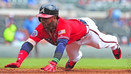 ATLANTA, GA - SEPTEMBER 10: Ozzie Albies #1 of the Atlanta Braves dives back to first base during the first inning against the Miami Marlins at SunTrust Park on September 10, 2017 in Atlanta, Georgia. (Photo by Scott Cunningham/Getty Images)