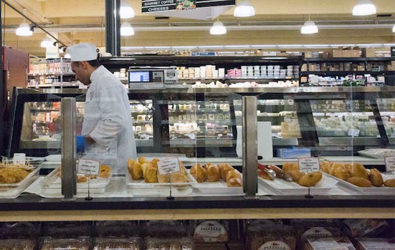 The chef in Buford Highway Farmers Market's bread and pastry section fills an order for customers.