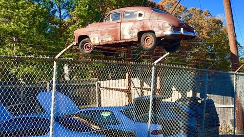 This longtime car lot in East Decatur is part of the proposed 9.7 mixed use development approved by city commissioners last year. This and eight other businesses get shuttered for good sometime next fall when developer Alliance Realty Services finally closes on the tract. Bill Banks file photo for the AJC