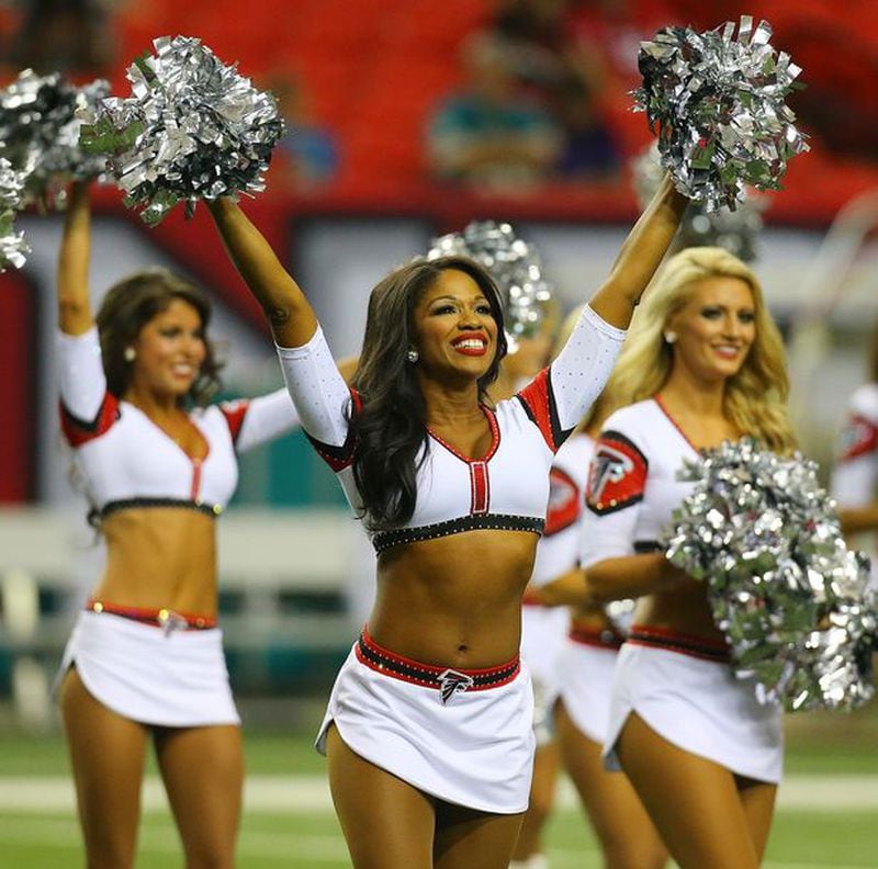 The Falcons cheerleaders perform to open the game against Miami during an NFL exhibition game on Friday, August 8, 2014, in Atlanta. (By Curtis Compton)