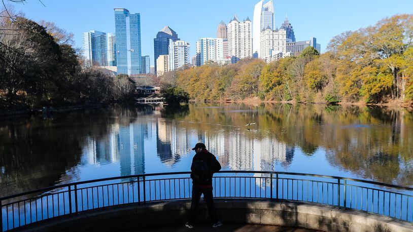 Mason Voudrie takes in the first day of winter at Piedmont Park Wednesday. JOHN SPINK / JSPINK@AJC.COM