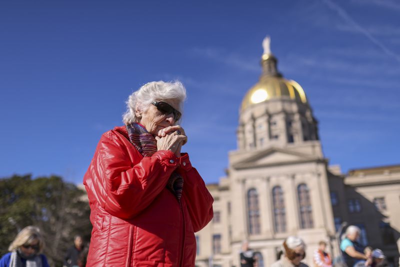 An anti-abortion advocate prays during the Georgia March for Life rally at Liberty Plaza next to the Georgia State Capitol on Jan. 20, 2023, in Atlanta. (Jason Getz/The Atlanta Journal-Constitution
)