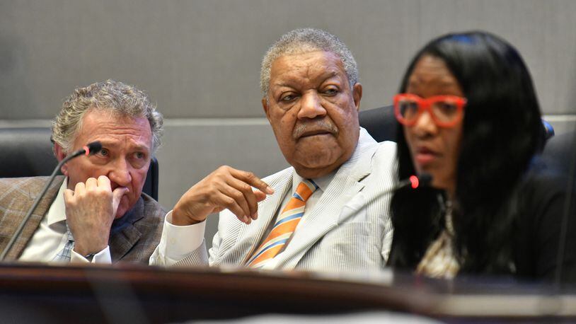 Fulton County Commissioner Lee Morris (left)  and Commission Chairman Robb Pitts confer during a meeting at the Fulton County government building in Atlanta. (Hyosub Shin / Hyosub.Shin@ajc.com)