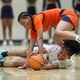 Mill Creek forward Kayla Harper (20) and North Cobb forward Sonia Velez (23, top) fight for a loose ball during the first half of the first round of the girls’ Class 7A playoffs at Mill Creek High School, Tuesday, February 20, 2024, in Hoschton, Ga. North Cobb won 45-40. (Jason Getz / jason.getz@ajc.com)