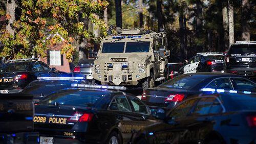 Police vehicles are seen near Ridgeview Institute on South Cobb Drive where a man walked in and opened fire after he fought with staff, Wednesday, Nov. 16, 2016, in Smyrna, Ga. BRANDEN CAMP/SPECIAL