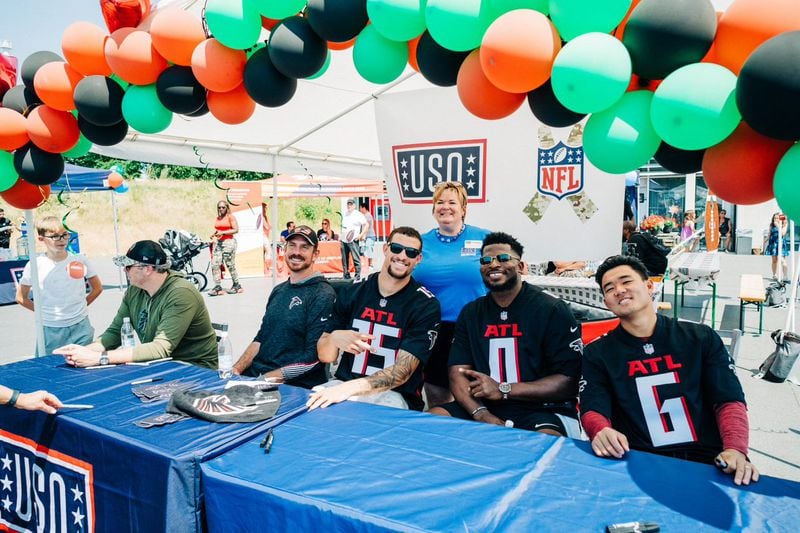 Falcons coach Arthur Smith, defensive coordinator Ryan Nielsen, tight end Feleipe Franks, outside linebacker Lorenzo Carter and kicker Younghoe Koo (left to right) recently visited U.S. service members deployed overseas when they went on an United Service Organizations (USO) tour to Germany, Romania and Bulgaria.