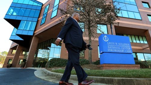 Dr. Louis W. Sullivan, the founding dean and first president of Morehouse School of Medicine, walks past the building bearing his name, the Louis W. Sullivan National Center for Primary Care.