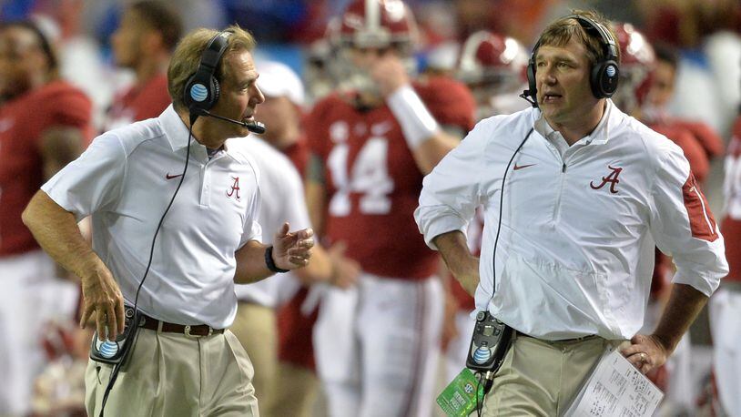That was then:  Alabama head coach Nick Saban and his defensive coordinator Kirby Smart exchange thoughts during 2015 SEC Championship at the Georgia Dome. ( BRANT SANDERLIN/AJC)