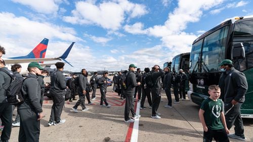 Michigan State arrives at Hartsfield-Jackson Atlanta International Airport for the Chick-fil-A Peach Bowl NCAA college football game Friday, Dec. 24, 2021, in Atlanta, Ga. Michigan State will face Pitt in the game on Dec.30, 2021. (Paul Abell via Abell Images for the Chick-fil-A Peach Bowl)