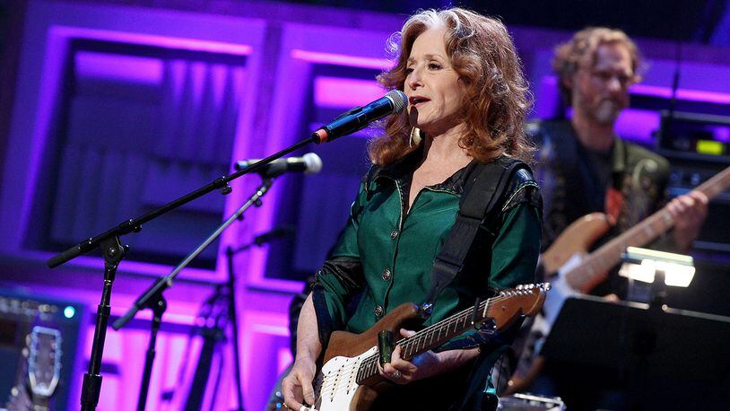 Singer-songwriter Bonnie Raitt will no longer join James Taylor on the first leg of his tour as she is scheduled for an unspecified surgery. (Photo by Terry Wyatt/Getty Images for Americana Music)