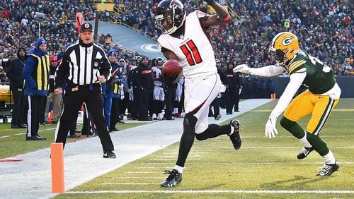 Julio Jones of the Atlanta Falcons scores a touchdown in front of Josh Jackson of the Green Bay Packers during the first half of a game at Lambeau Field on December 09, 2018 in Green Bay, Wisconsin. (Photo by Stacy Revere/Getty Images)