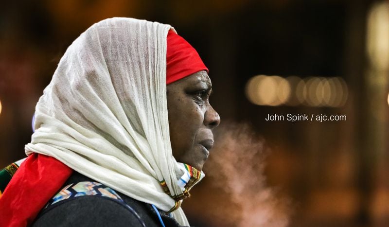 Janice Henry waits in 20-degree weather at the Five Points MARTA station Wednesday morning.