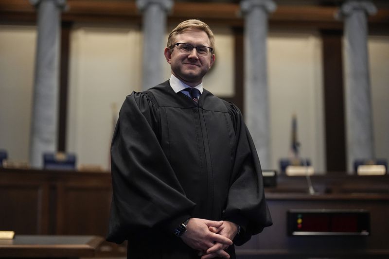 Supreme Court Justice Andrew Pinson has avoided speaking directly about issues that could come before the court while campaigning for reelection. (AP Photo/Mike Stewart)