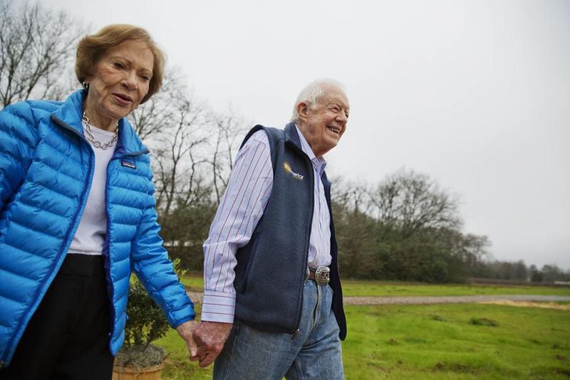 Former President Jimmy Carter, right, and his wife Rosalynn arrive for a ribbon cutting ceremony for a solar panel project on farmland he owns in their hometown of Plains, Ga., Wednesday, Feb. 8, 2017.  (AP Photo/David Goldman)