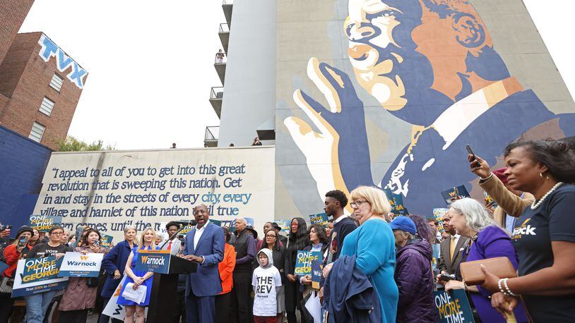 Democratic nominee for U.S Senate Sen. Raphael Warnock speaks at the site of the John Lewis mural, Thursday, November 10, 2022, in Atlanta. Warnock is in a runoff with republican nominee Herschel Walker on Dec. 6, 2022. (Jason Getz / Jason.Getz@ajc.com)