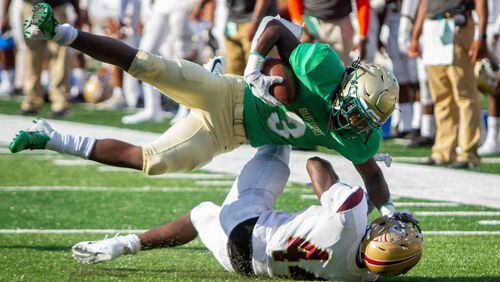 Buford's Derrian Brown is tackled by Tucker's Lucius Chitty during the 2018  Corky Kell Classic Friday, Aug.17, 2018, at Georgia State Stadium in Atlanta.