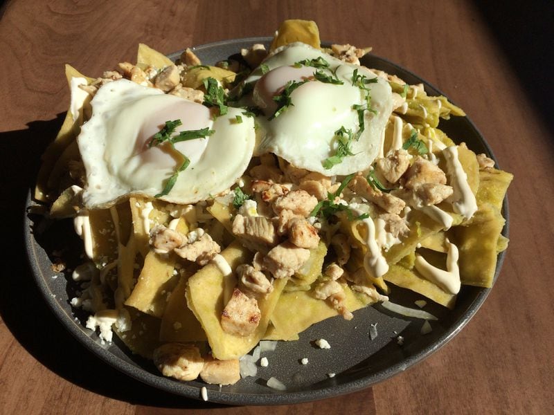 La Mixteca’s chicken chilaquiles, shown here with fried eggs, are on the crunchy side. CONTRIBUTED BY WENDELL BROCK