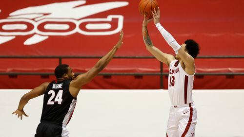 Georgia's P.J. Horne (24), here defending Alabama's Jahvon Quinerly, and the Bulldogs played poor perimeter defense in a 33-point loss to the Crimson Tide this past Saturday in Tuscaloosa. (Photo from UA Athletics) 
Photo by Crimson Tide Photos
