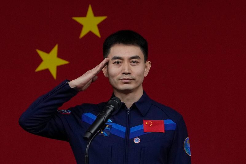Chinese astronaut for the upcoming Shenzhou-18 mission Ye Guangfu salutes during a meeting with media members at the Jiuquan Satellite Launch Center in northwest China, Wednesday, April 24, 2024. (AP Photo/Andy Wong)