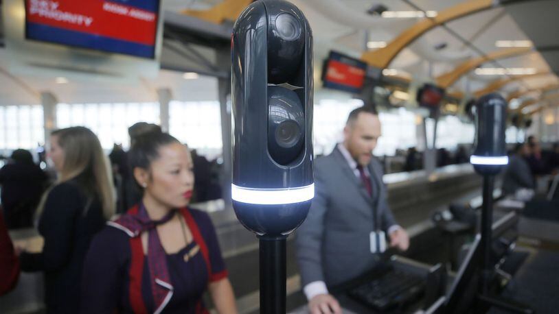 Cameras mounted on poles at the check-in counter scan travelers as they approach so the agent can have your flight info pulled up when you reach the counter. BOB ANDRES / BANDRES@AJC.COM