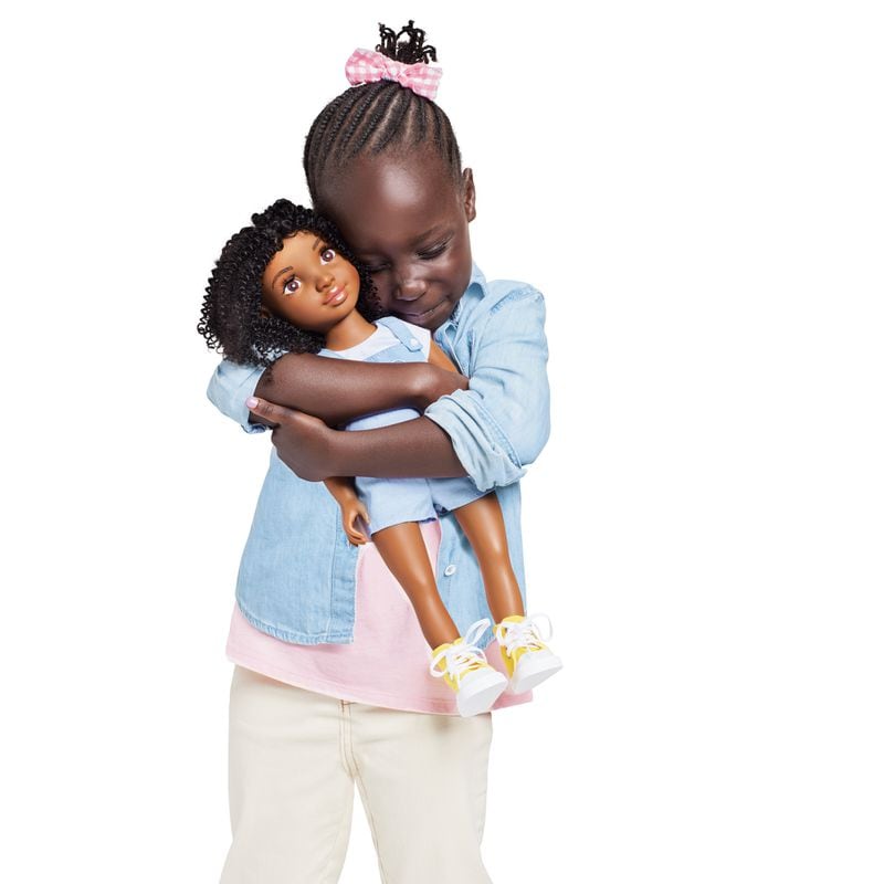 Little girls can be seen reflected in a doll with curly, textured hair named Zoe by Healthy Roots Lifestyle.
