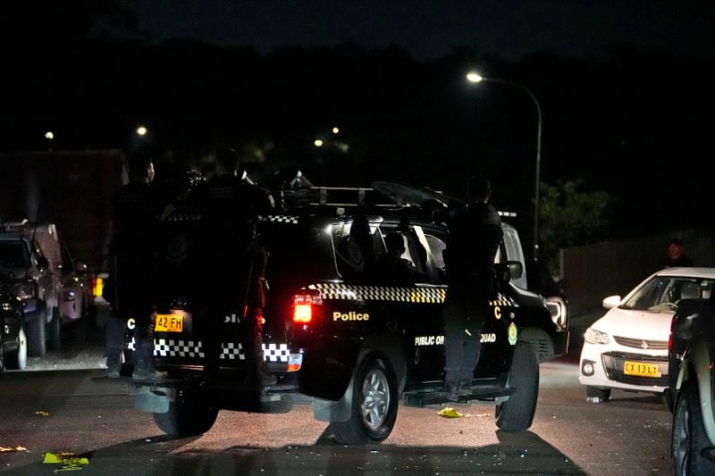 Riot police drives away after securing outside a church where a bishop and churchgoers were reportedly stabbed in Sydney Australia, Monday, April 15, 2024. Police in Australia say a man has been arrested after a bishop and churchgoers were stabbed in the church. There are no life-threatening injuries. (AP Photo/Mark Baker)