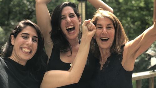 Emily Green (center) celebrates with her sister Clara (left) and their mother, Amy Totenberg, after learning about Emily’s Pulitzer win. CONTRIBUTED: EMILY GREEN