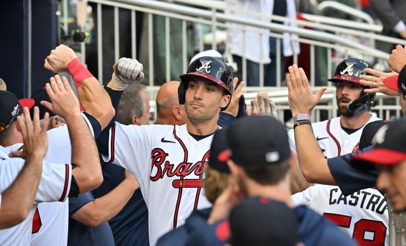 Atlanta Braves' Matt Olson hits a three-run homer during the ninth inning of game one of the baseball playoff series between the Braves and the Phillies at Truist Park in Atlanta on Tuesday, October 11, 2022. (Hyosub Shin / Hyosub.Shin@ajc.com)