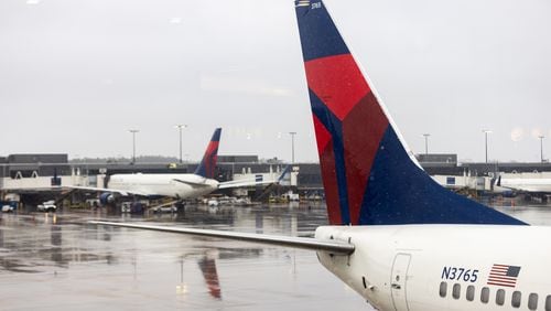 Delta airplanes are seen on the tarmac at Hartsfield Jackson International Airport in Atlanta, Georgia on January 16th, 2022 as a winter storm impacts travel.