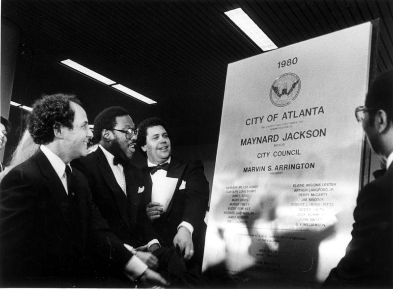 Former Mayor Massell, Council President Marvin Arrington and Mayor Jackson unveil plaque at dedication of the new Atlanta Airport on Sept. 19,1980. Hartsfield Int'l Airport-Midfield Terminal