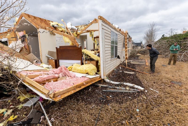 National Weather Service employees survey the tornado damage homes in the Lexington Park neighborhood in LaGrange Friday, Jan 13, 2023. (Steve Schaefer/steve.schaefer@ajc.com)