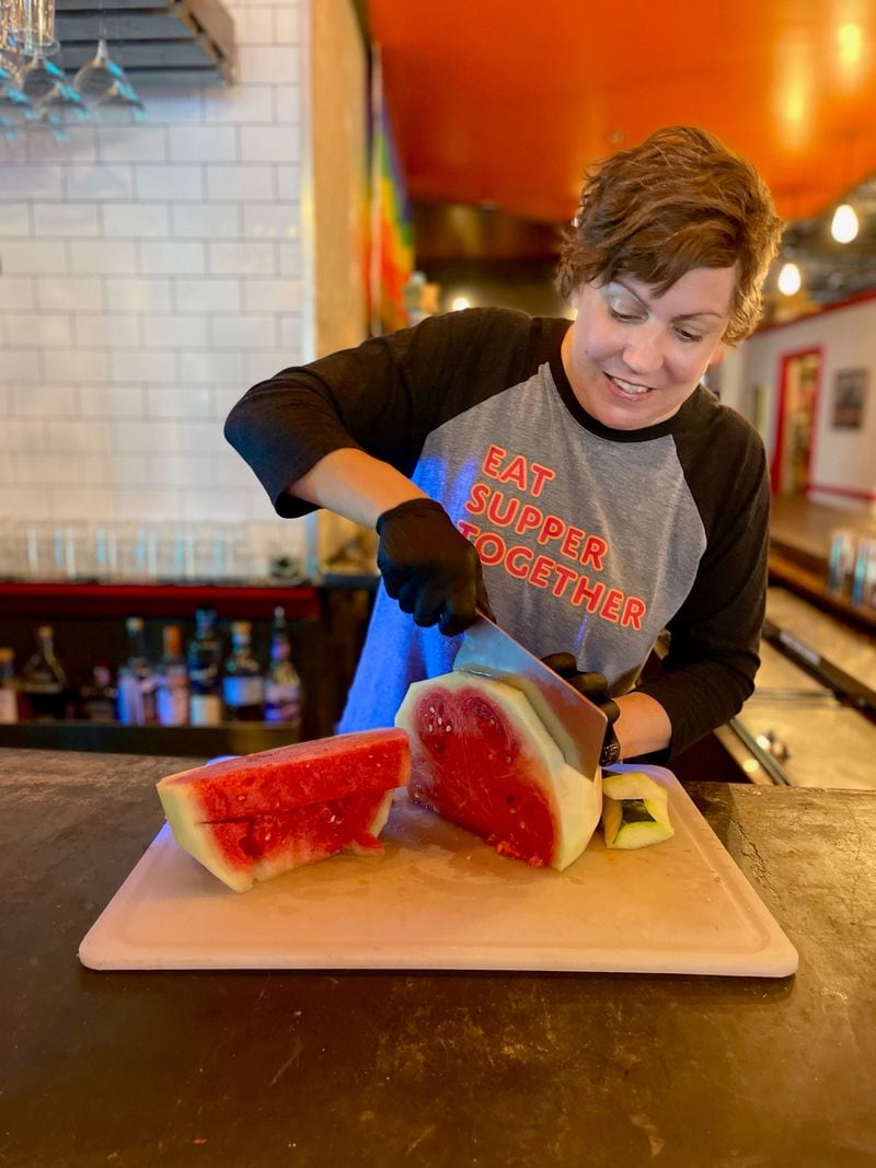 Emily Chan of JenChan’s in Cabbagetown trims the hard green rind off a watermelon in preparation for making a Watermelon-Basil Slushie.
(Courtesy of Jen Chan)