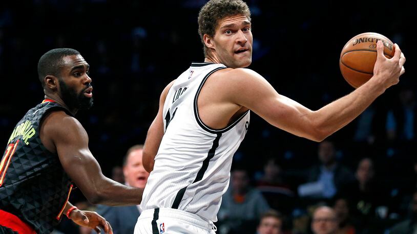 Brooklyn Nets center Brook Lopez drives to the basket past Atlanta Hawks guard Tim Hardaway Jr. during the first half of an NBA basketball game Sunday, April 2, 2017, in New York. The Nets won 91-82. (AP Photo/Adam Hunger)p