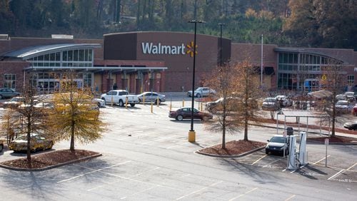 The parking lot of the East Point Walmart was mostly empty Friday afternoon after the store's loss prevention officer was shot while confronting a shoplifting suspect, authorities said.