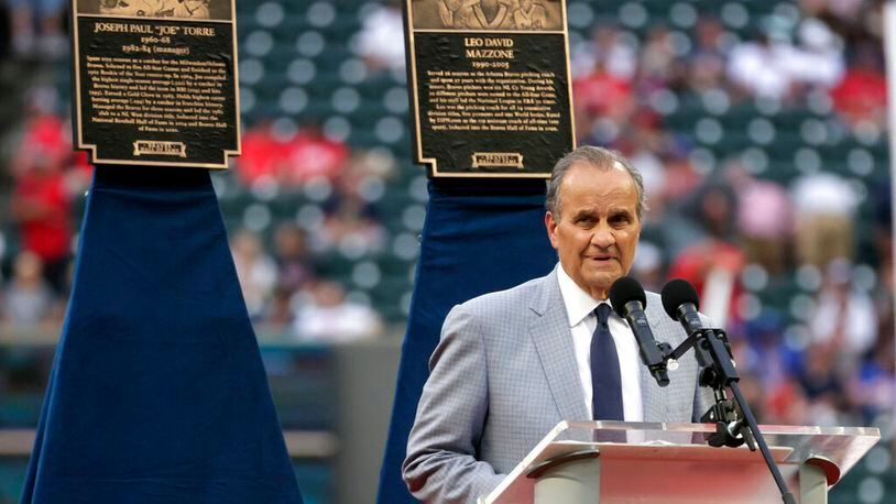 Joseph Paul "Joe" Torre speaks as he is inducted into the Braves Hall of Fame before the baseball game between the Atlanta Braves and the Arizona Diamondbacks Saturday, July 30, 2022, in Atlanta. (AP Photo/Butch Dill)