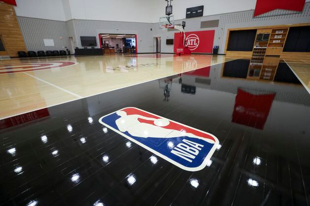 The NBA logo is shown on the main court at the practice facility in the Brookhaven area, Thursday, May 16, 2024, in Atlanta. The Atlanta Hawks are giving us access to the areas of the practice facility that are not accessible and areas fans would never see. The areas to be photographed, Main court, locker room, weight room, kitchen, player film room, upstairs conference room, and TV studiio. (Jason Getz / AJC)
