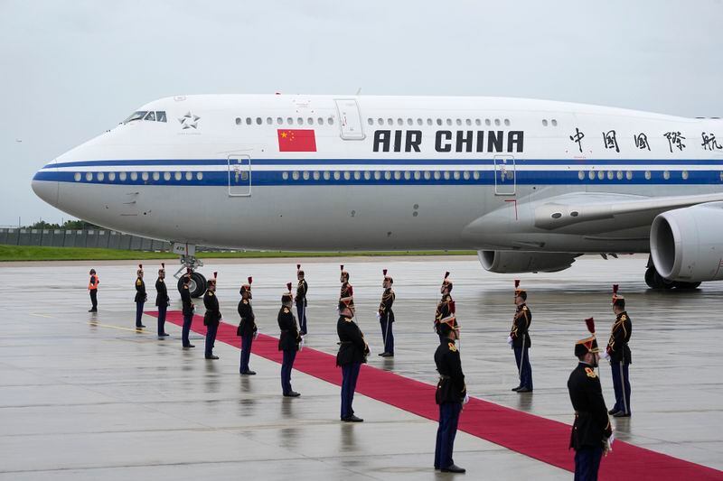 The plane carrying China's President Xi Jinping arrives Sunday, May 5, 2024 at Orly airport, south of Paris. French President Emmanuel Macron will seek to press China's Xi Jinping to use his influence on Moscow to move towards the end of the war in Ukraine, during a two-day state visit to France that will also see both leaders discuss trade issues. (AP Photo/Michel Euler, Pool)