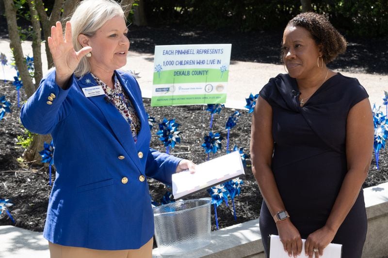 DeKalb County District Attorney Sherry Boston (Right) and Prevent Child Abuse executive Director Jennifer Stein speak to the crowd that gathered in front of the Dekalb County Courthouse on Tuesday, April 23, 2024.  (Steve Schaefer / AJC)