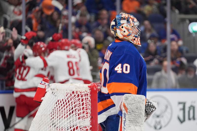 New York Islanders goaltender Semyon Varlamov (40) reacts as the Carolina Hurricanes celebrate a goal by Stefan Noesen during the third period of Game 4 of an NHL hockey Stanley Cup first-round playoff series Saturday, April 27, 2024, in Elmont, N.Y. (AP Photo/Frank Franklin II)