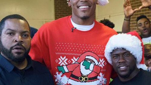Cam Newton is on top of the world but his Christmas sweater..