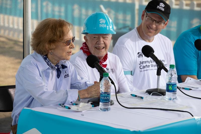 Jonathan Reckford, right, listens to Rosalynn Carter, left, speak on the first day of a "build" event in 2018 for Habitat for Humanity, a nonprofit organization the Carters supported after they left the White House.  (PHOTO courtesy of Habitat for Humanity International/Jason Asteros)