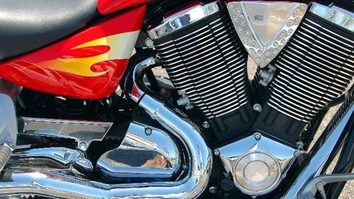 File photo of a motorcycle engine. A Florida motorist posted a video Saturday that shows a motorcycle rider steering the bike with his feet — at full speed — on I-95.