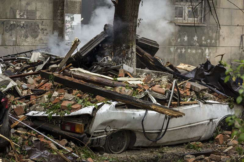 In this photo provided by the Dnipropetrovsk Regional Military Administration, a damaged car is seen at the site of a Russian attack in Dnipro, Ukraine, Friday, April 19, 2024. (Dnipropetrovsk Regional Military Administration via AP Photo)