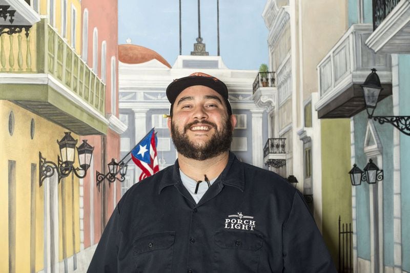 Andre Gomez, chef and owner of Porch Light Latin Kitchen, was raised in Puerto Rico. Gomez wants his restaurant to reflect the things that influenced his upbringing. Chad Rhym/ Chad.Rhym@AJC.com