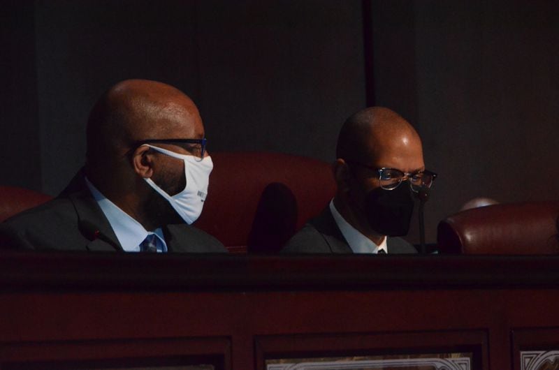 Councilmemembers Byron Amos (left) and Jason Dozier (right) during Monday's Atlanta City Council meeting. (Courtesy/Atlanta City Council)