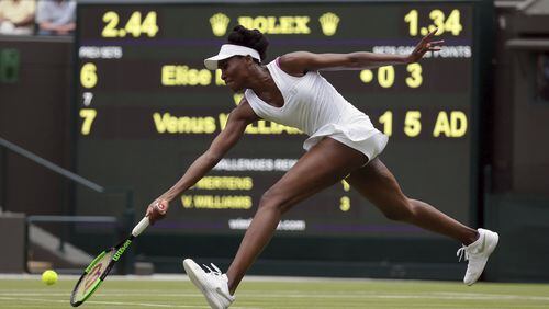 Venus Williams of the United States returns to Belgium’s Elise Mertens during their Women’s Singles Match on day one at the Wimbledon Tennis Championships in London Monday, July 3, 2017. (AP Photo/Tim Ireland)