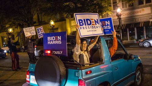 Biden supporters along W Ponce de Leon Ave in Decatur as elections results become more clear and celebrations of President-Elect Joe Biden and VP Kamala Harris take place all over Atlanta on Saturday, Nov 7, 2020.  (Jenni Girtman for The Atlanta Journal-Constitution)