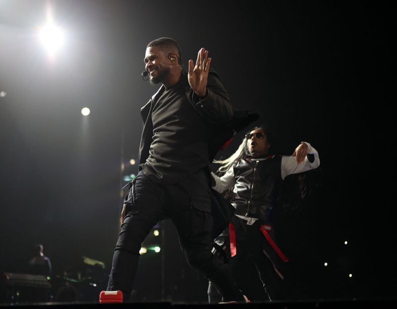 Dec. 9, 2014 - ATLANTA: Usher displays his famous moves for his opening set of his UR Experience tour in Atlanta performing at the Philips Arena. The UR Experience is the precursor to the release of his eighth studio album entitled UR. Dance favorite "Good Kisser"was released as the lead single off the album. (Akili-Casundria Ramsess/Special to the AJC) Usher brought his smooth moves to Philips Arena last month for a hometown show. Photo: Akili-Casundria Ramsess/Special to the AJC.
